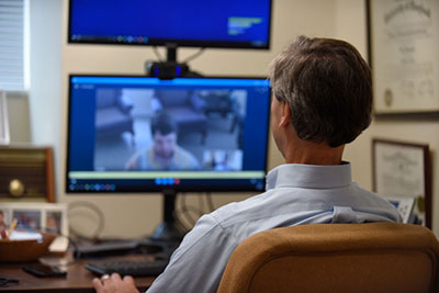 Dr. Weintraub in front of computer